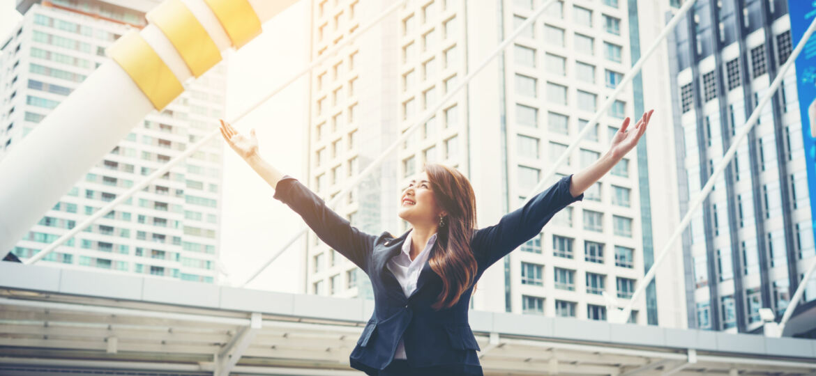 happy-businesswoman-exults-pumping-fists-ecstatic-celebrates-success-outdoor