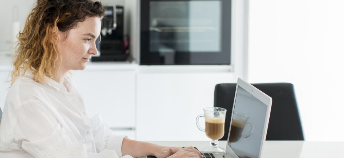 side-view-woman-working-laptop